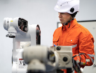 Robotic engineer examining robot power gear machine for repairing service. Modern technology...