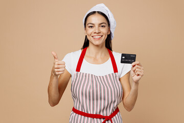 Young smiling happy housewife housekeeper chef baker latin woman wear striped apron toque hat...