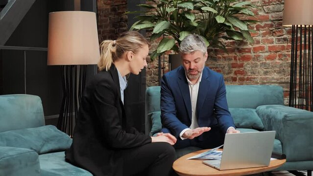 Two businessmen negotiators wear formal suits shake hands after successful negotiations, seller banker advisor handshake partner client investor make investment partnership deal agreement trust goal.