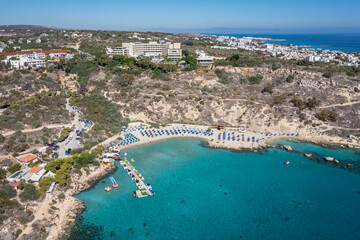 Konnos Beach in Konnos Bay in area of Cape Greco National Forest Park in Cyprus, view with Grecian Park Hotel