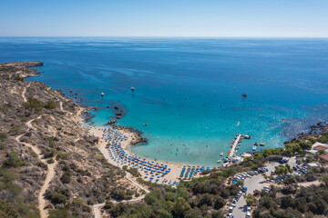 Fototapeta na wymiar Aerial view with Konnos Beach in Konnos Bay in area of Cape Greco National Forest Park in Cyprus