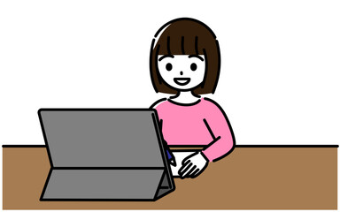 笑顔でタブレット学習をする小学生の女の子