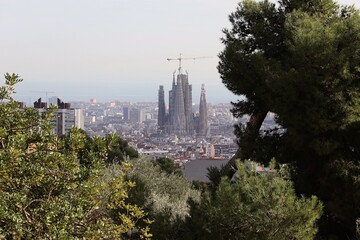 Fototapeta na wymiar A view at Sagrada Familia from Parc Güell, Barcelona, Spain.