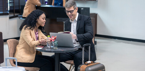 Two business workers are waiting and taking facility service at an exclusive airline lounge....