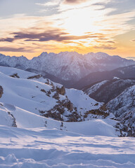 winter mountain landscape with snow during sunset
