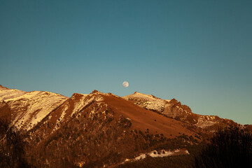 Mountain Peak at Sunset with Full Moon in Val di Susa