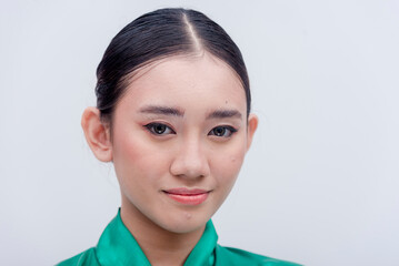 A close up studio shot with white background of a Southeast Asian pretty lady dressed in a green silk cloth bathrobe.