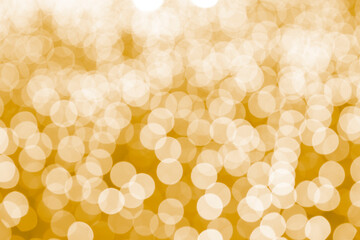 Abstract yellow bokeh background. The bokeh lights refocused blurred background.