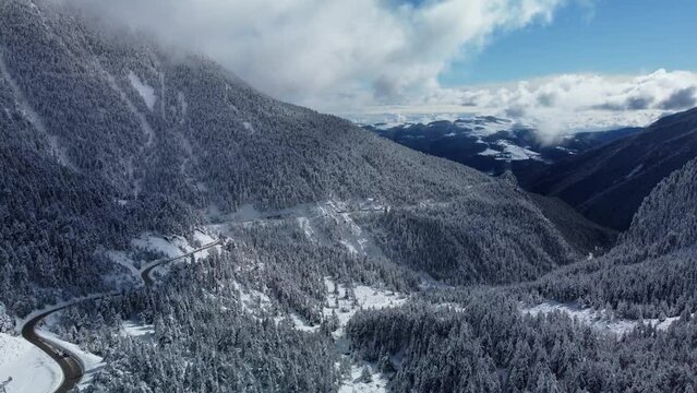 Aerial winter landscape over Vallter 2000 road. Setcases, Ripoll&eacute;s, Girona Pyrenees, Catalonia. Vacations, travel, nature and tourism concept. 4k drone video.