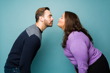 Boyfriend and girlfriend about to kiss on a romantic date