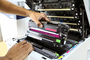 Technician hand open cover printer photocopier or photocopy to replace ink cartridges or fix paper...
