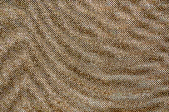 Closeup detail of beige fabric texture background.