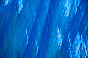 abstract blue background with some smooth lines in it and some motion blur