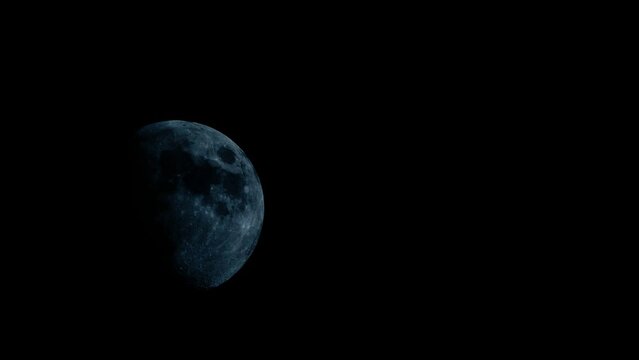 Crescent moon moves quickly in the dark sky. Horror Movie Half Moon in the Dark Sky