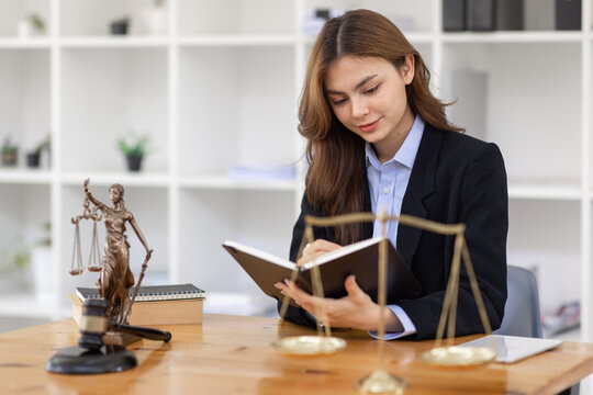 female business woman lawyers working at the law firms. Judge gavel with scales of justice. Legal law, lawyer, documents, advice and justice concept.