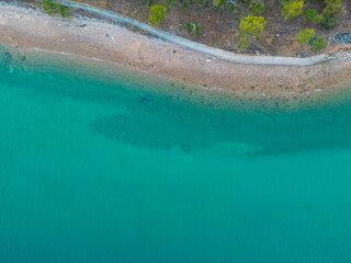 Aerial view sea wave beach with walk way