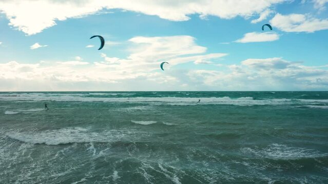 Kate surfing, in Puglia, rough sea