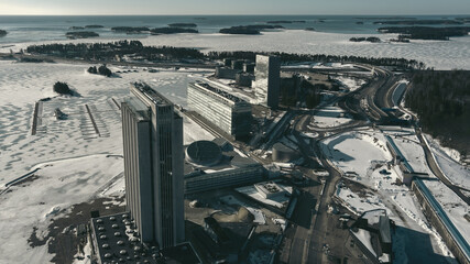 Aerial view of a freeway intersection Snow-covered in winter.Busy intersection. Birds eye view from drone. Cityscape