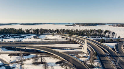 Aerial view of a freeway intersection Snow-covered in winter.Busy intersection. Birds eye view from drone. Cityscape