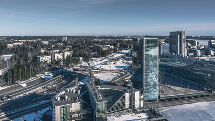 Aerial view of a freeway intersection Snow-covered in winter.Busy intersection. Birds eye view from drone. Cityscape