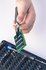 Technician fixing computer. Repair and upgrade concept of laptop. Workshop background