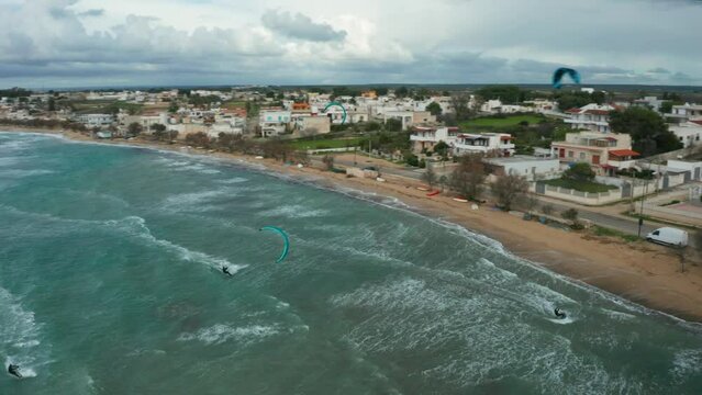 Kate surfing, in Puglia, rough sea, shot from above 12