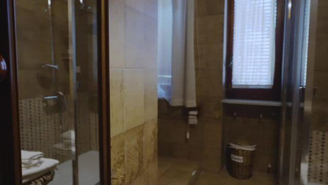 Mediterranean style bathroom interior with shower.