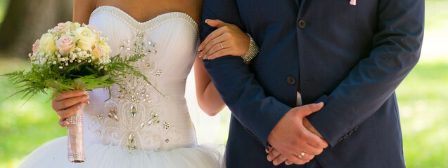 Bride and groom during the wedding on a sunny summer day	