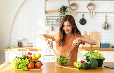 Portrait of beauty body slim healthy asian woman having fun cooking and preparing cooking vegan...