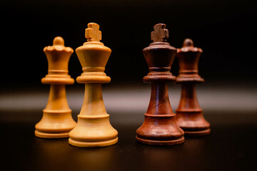 face to face between king and black queen against king and white queen of chess, challenge, duel,...