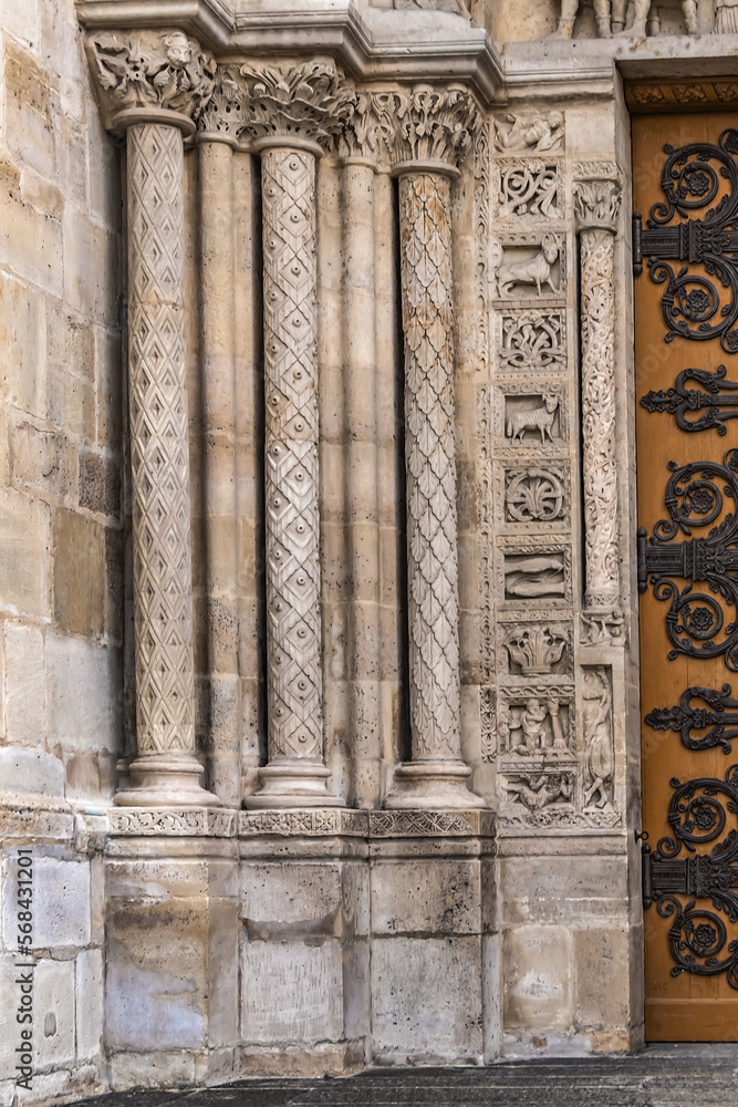 Wall mural Fragments of the facade of Basilica of Saint-Denis (Basilique royale de Saint-Denis, from 1144) - former medieval abbey church in city of Saint-Denis, a northern suburb of Paris. France.