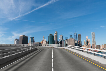 Empty urban asphalt road exterior with city buildings background. New modern highway concrete construction. Concept of way to success. Transportation logistic industry fast delivery. New York. USA.