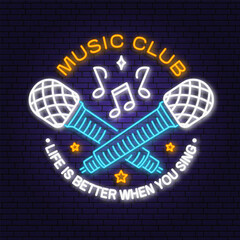 Music club neon poster, banner. Neon sign, emblem, bright signboard, light banner with microphone. Vector illustration. Equipment for listening and recording sound. Advertising bright neon for night