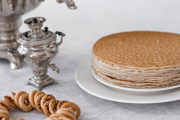Russian traditions. Russian holiday Maslenitsa. Still life with bagels, a stack of pancakes and a...