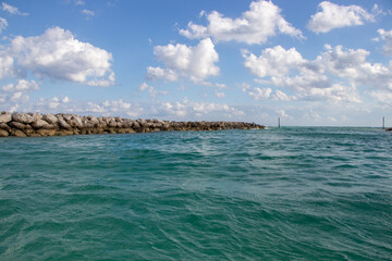 rock jetty wall on tropical ocean