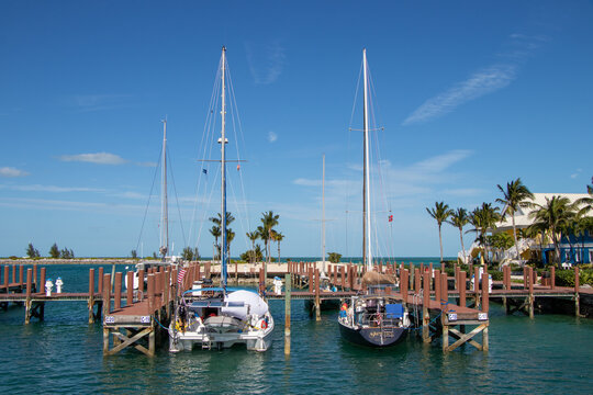 West End, Grand Bahama Island, Bahamas - January 6, 2023: Sailing vessels at the dock at Old Bahama Bay Resort and Marina. The port offers a resort, marina and customs office.