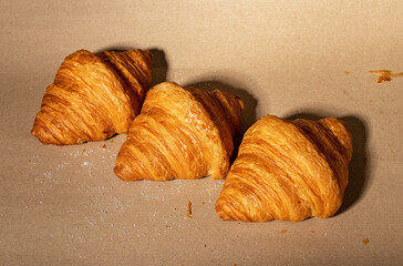 Fresh french croissants row. Puff craft bakery
