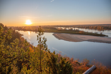 Naklejka na ściany i meble Sunset with a view of the Vistula River in Mięćmierz, Poland