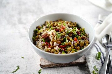 Homemade lentil brown rice salad with vegetables | Healthy eating concept, selective focus - obrazy, fototapety, plakaty