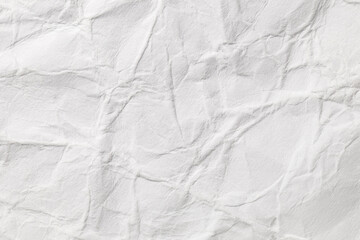 Crumpled white paper, uneven surface, background texture, close-up