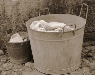 bucket and tub for doing the laundry with sepia effect from the 1920s