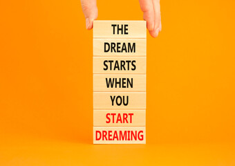 Start dreaming symbol. Concept words The dream starts when you start dreaming on wooden blocks....