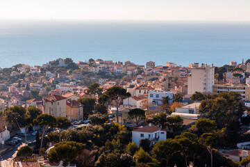 Fototapeta na wymiar Marseille, France - FEB 28, 2022: Beautiful horizon view with golden sunlight from the coast of Marseille