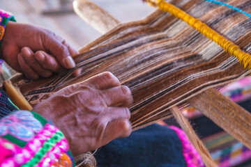 Woman weaver of handmade form.