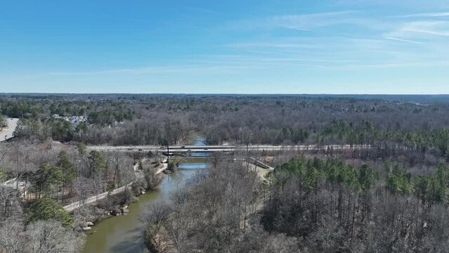 Aerial shot above a crossing of a river in Raleigh, NC.
