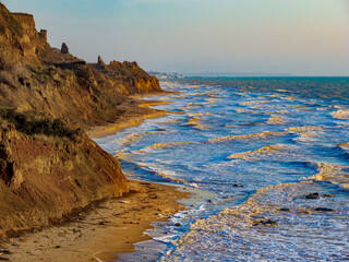 Scenic surf at the sunset seaside