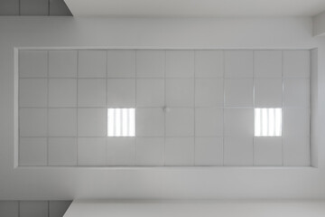 cassette stretched or suspended ceiling with square halogen spots lamps and drywall construction in...