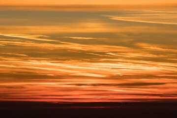 Orange sky and beautiful cloudscape on fire during sunrise