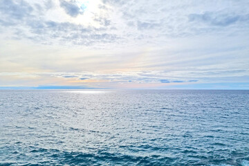 View from a height of the waters of the Atlantic Ocean and the blue sky.