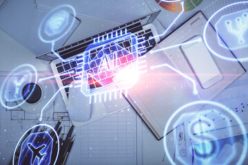 Multi exposure of data drawing hologram over topview of study desk background with computer. Concept of technology.